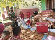 Babinsa Koramil 1305-09/Bokat Beri Semangat Kepada Para Siswi SD Saat di Vaksin HPV