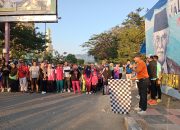 Jalan Santai di Kota Buol, Alek Bantilan Bagikan Doorprize Umroh